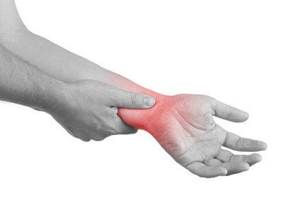 Male holding wrist in pain