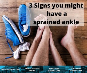 Man holding ankle with signs of a sprain