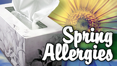 "spring allergies" text against flower & tissue box